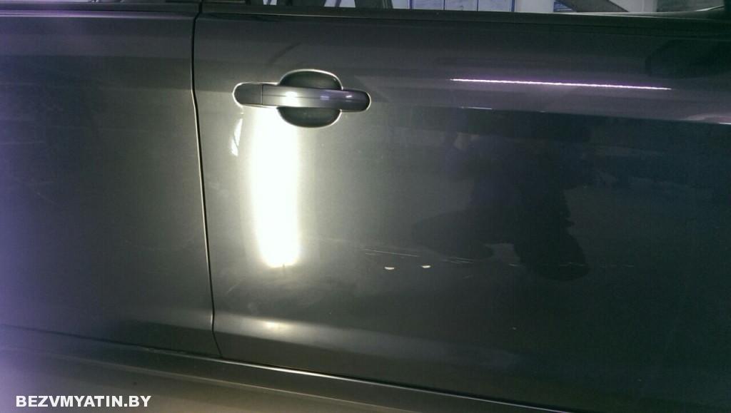 форд - повреждение на двери после ремонта